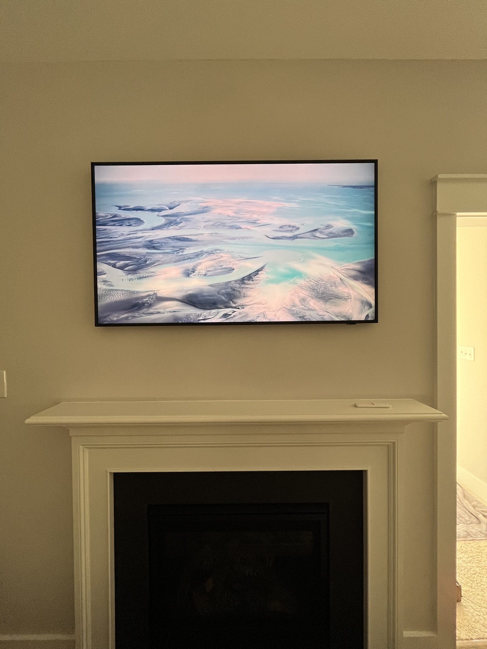 Wall-mounted television with wires concealed